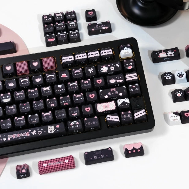 Add a playful touch to your keyboard with the Pink Purrmaid Keycap Set, featuring a unique pink and black cat design for cat lovers.