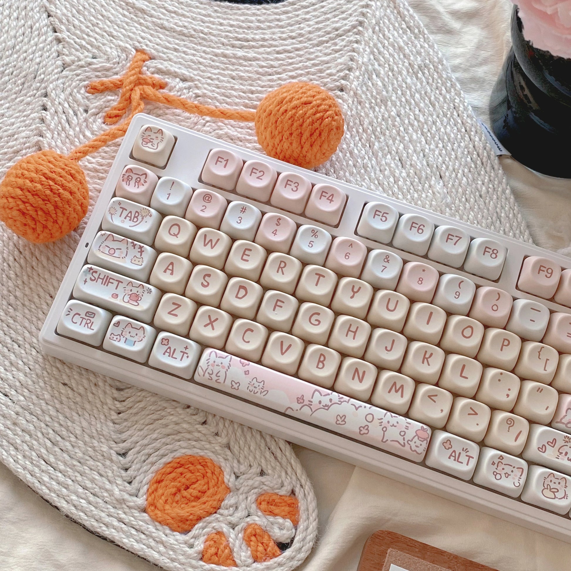 Pudding Paws Keycap Set featuring a cute white cat with pink and yellow accents for mechanical keyboards.