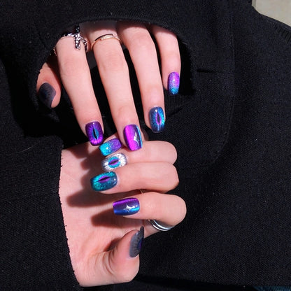 Purple, blue, and silver cat-eye press on nails, perfect for a gothic Halloween look