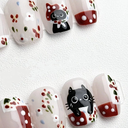 Gift for cat lovers: Purrfectly Polka Paws press-on nails featuring black cats and playful designs
