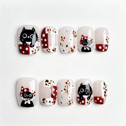 Purrfectly Polka Paws Handmade Press On Nails with cute black cat and polka dot designs
