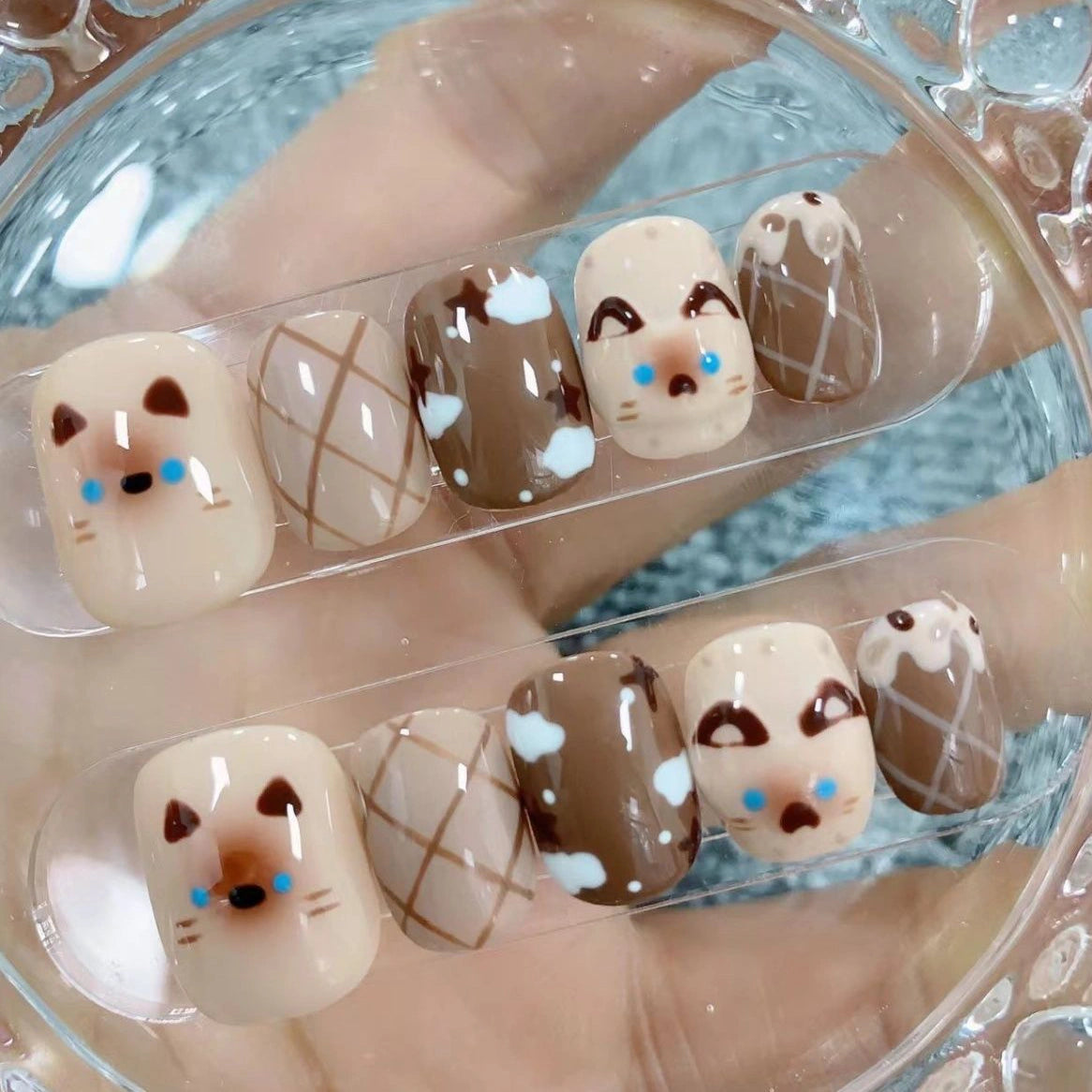 Cute Siamese cat-themed press-on nails with cozy brown tones, ideal gift for feline fans